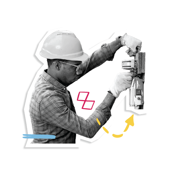 A man in a hard hat working on electrical equipment.